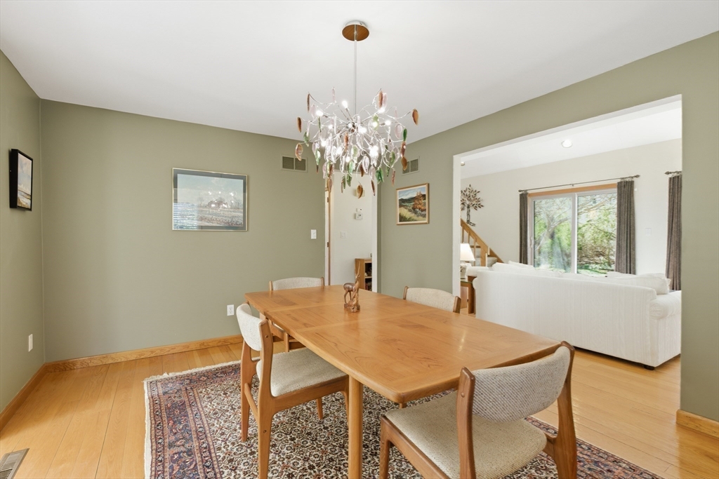 641 Salem End Road Framingham, MA 01702 - Photo 22 of 42 a view of a dining room with furniture and a chandelier