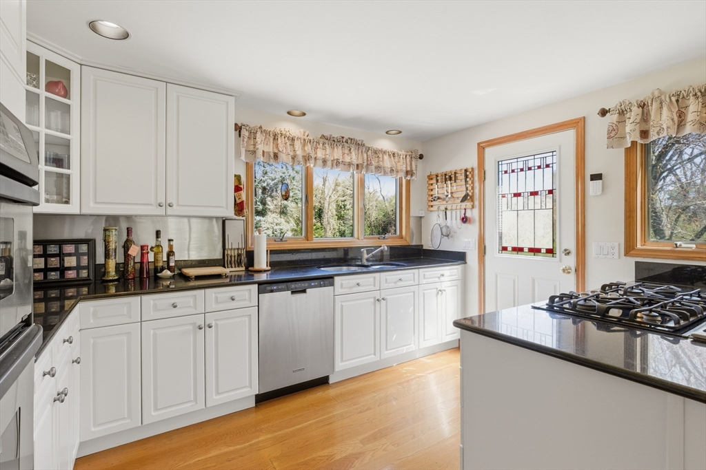 641 Salem End Road Framingham, MA 01702 - Photo 27 of 42 a kitchen with stainless steel appliances a sink stove and cabinets
