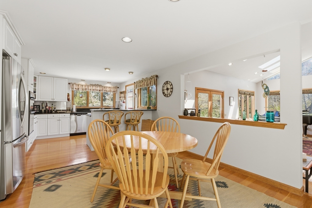 641 Salem End Road Framingham, MA 01702 - Photo 29 of 42 a dining room with furniture and wooden floor