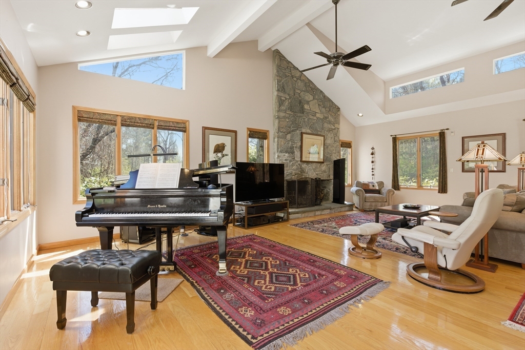641 Salem End Road Framingham, MA 01702 - Photo 32 of 42 a living room with furniture a rug and a flat screen tv