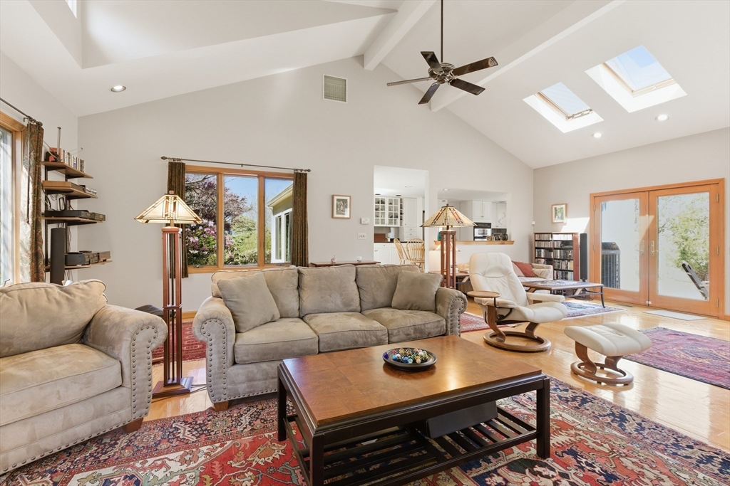 641 Salem End Road Framingham, MA 01702 - Photo 34 of 42 a living room with furniture a ceiling fan and a rug
