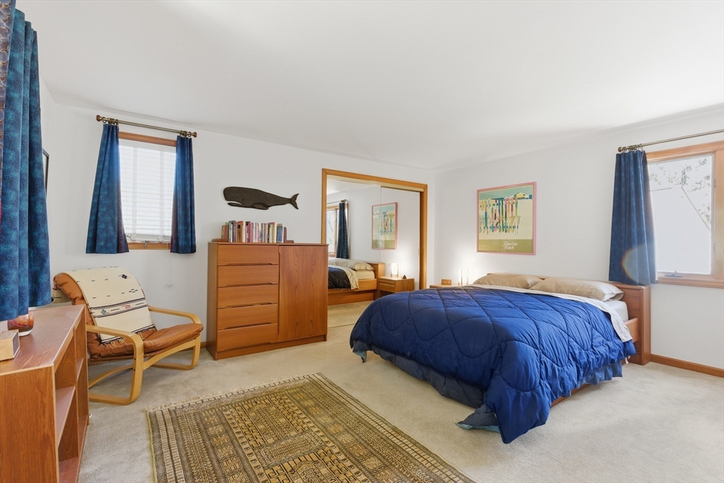 641 Salem End Road Framingham, MA 01702 - Photo 36 of 42 a bedroom with a bed and dresser with mirror