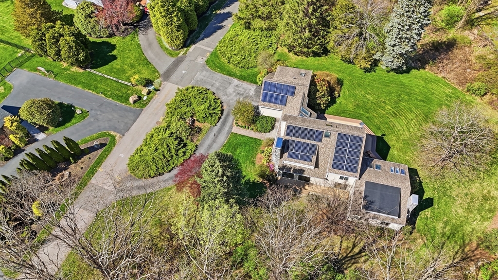 641 Salem End Road Framingham, MA 01702 - Photo 40 of 42 an aerial view of a house with a yard and large trees