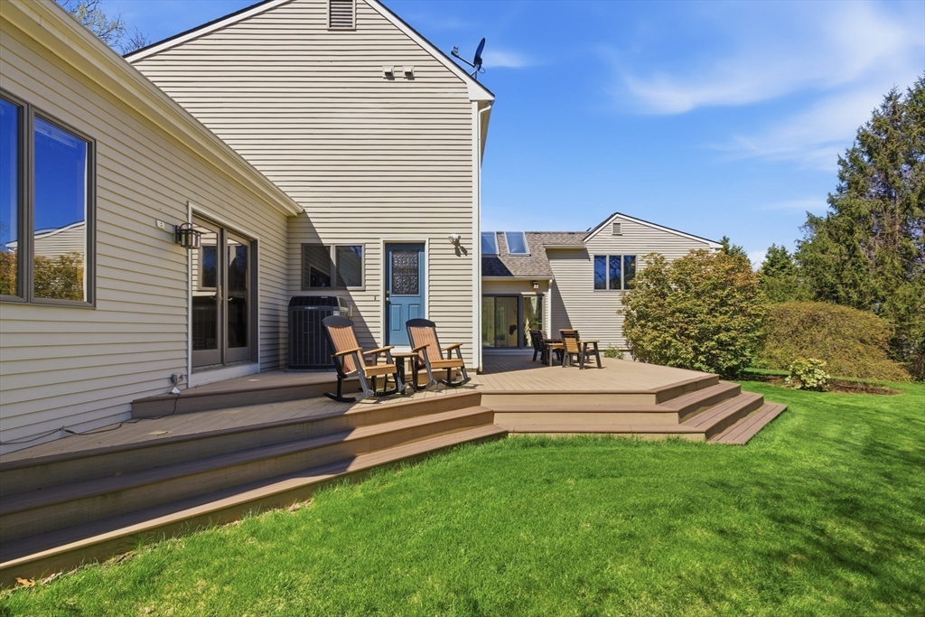 641 Salem End Road Framingham, MA 01702 - Photo 7 of 42 a view of a house with a yard and sitting area