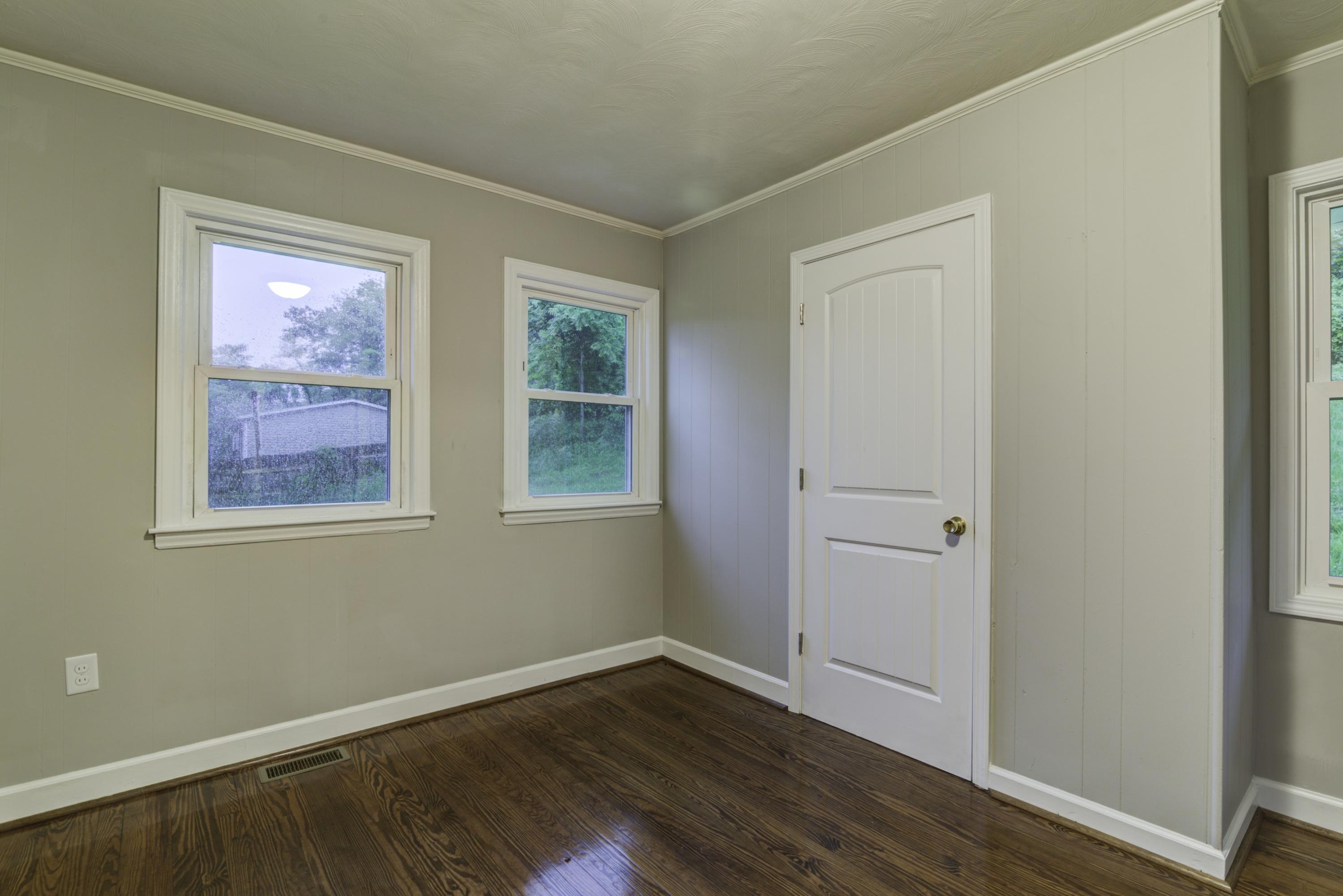 4600 Blue Ridge Boulevard Blue Ridge, VA 24064 - Photo 18 of 27 a view of an empty room with wooden floor and a window