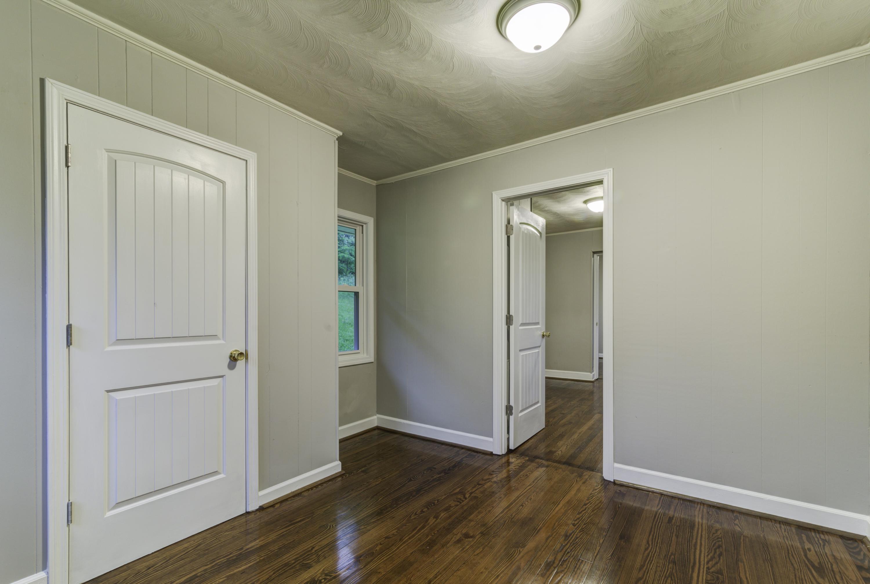 4600 Blue Ridge Boulevard Blue Ridge, VA 24064 - Photo 19 of 27 an empty room with wooden floor and closet