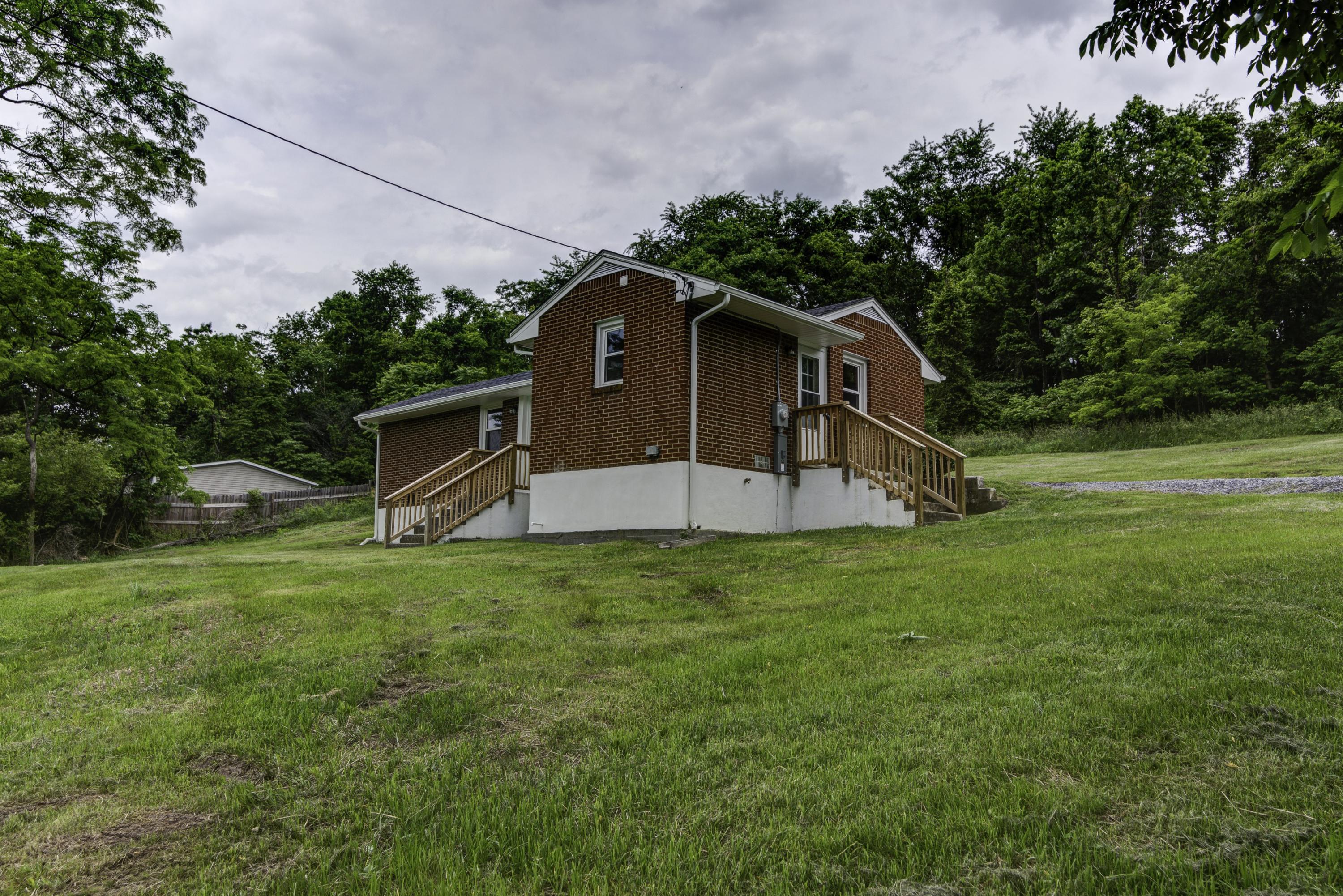 4600 Blue Ridge Boulevard Blue Ridge, VA 24064 - Photo 22 of 27 a front view of a house with a yard
