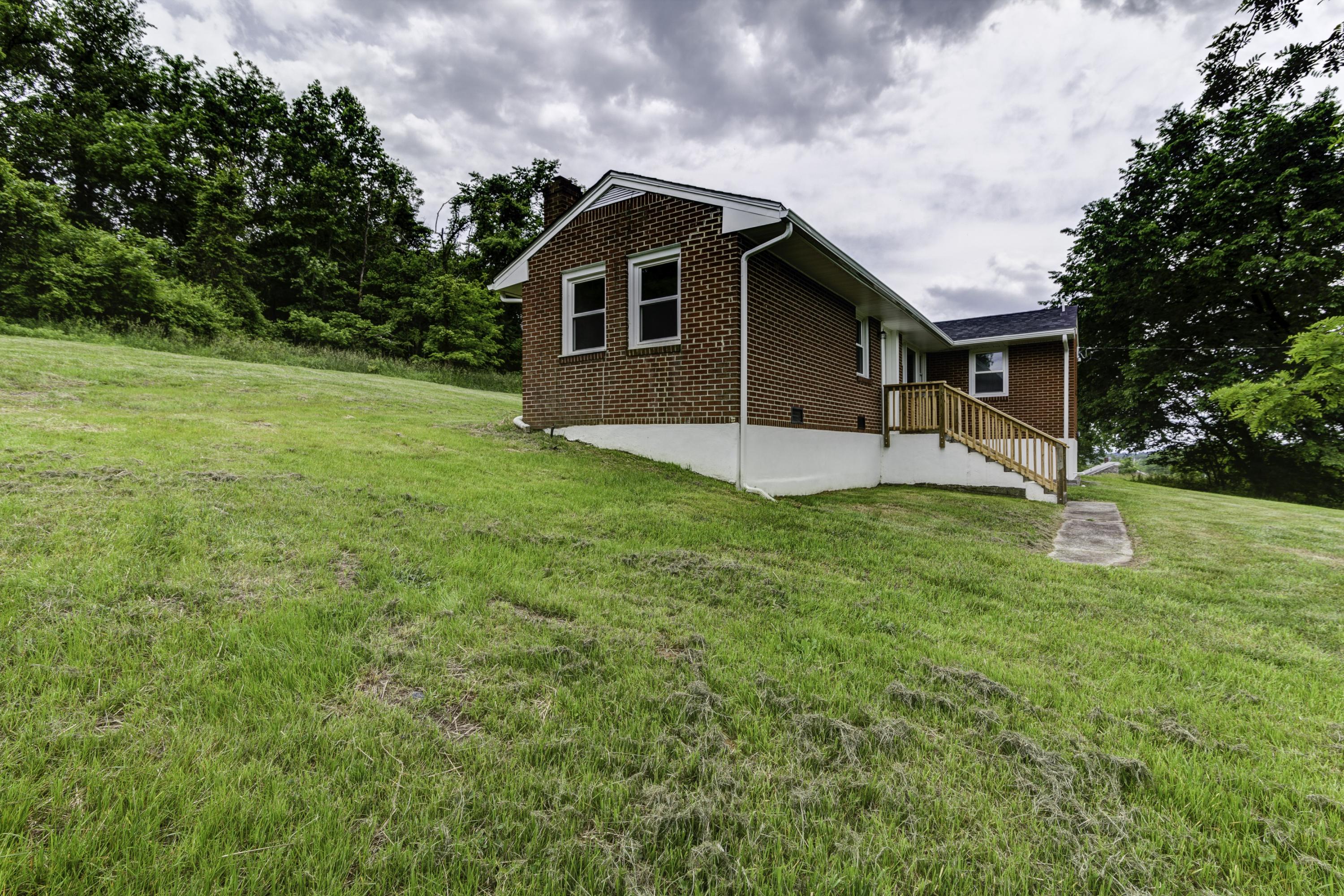 4600 Blue Ridge Boulevard Blue Ridge, VA 24064 - Photo 23 of 27 a front view of a house with yard and green space