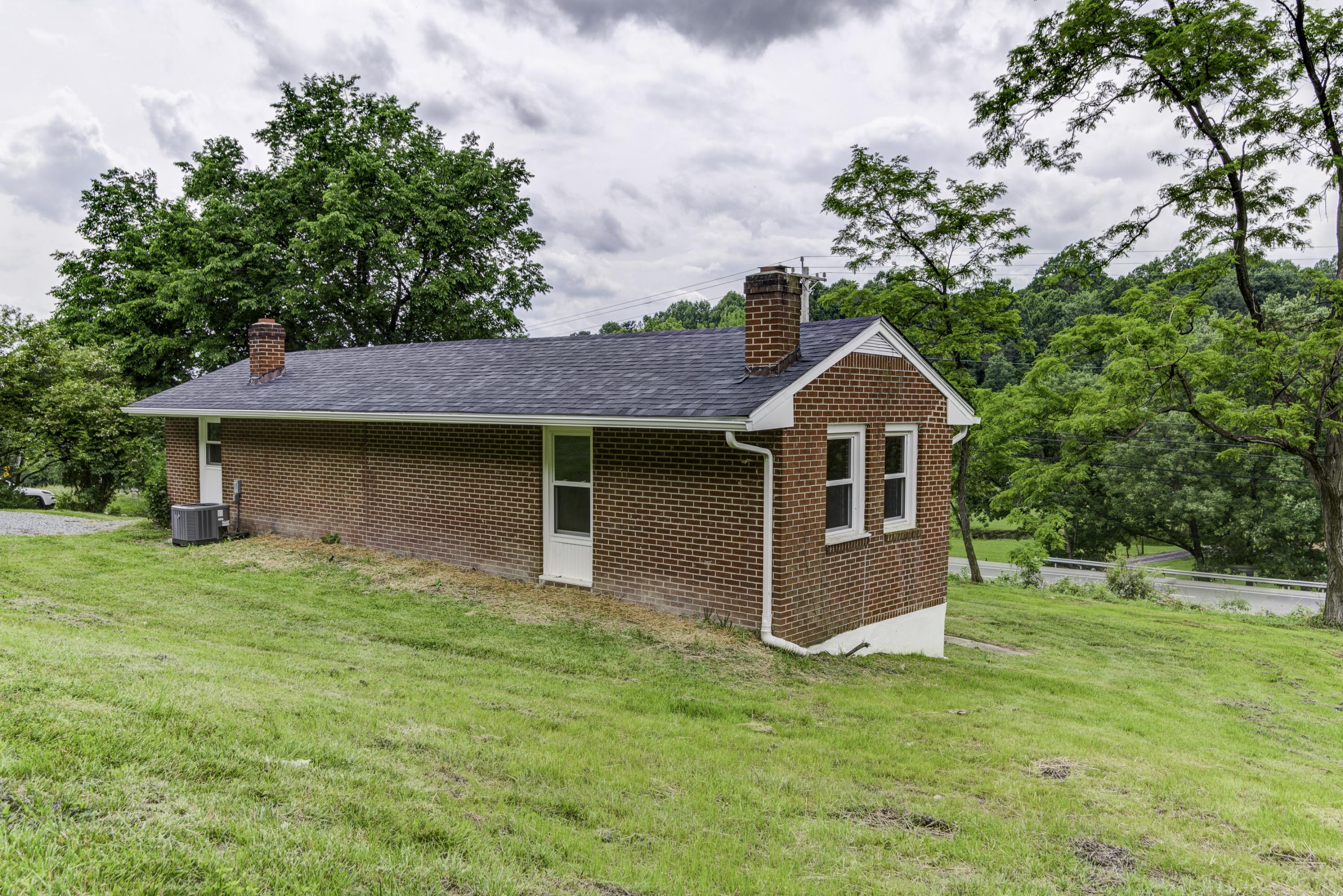 4600 Blue Ridge Boulevard Blue Ridge, VA 24064 - Photo 24 of 27 a front view of a house with a garden and yard
