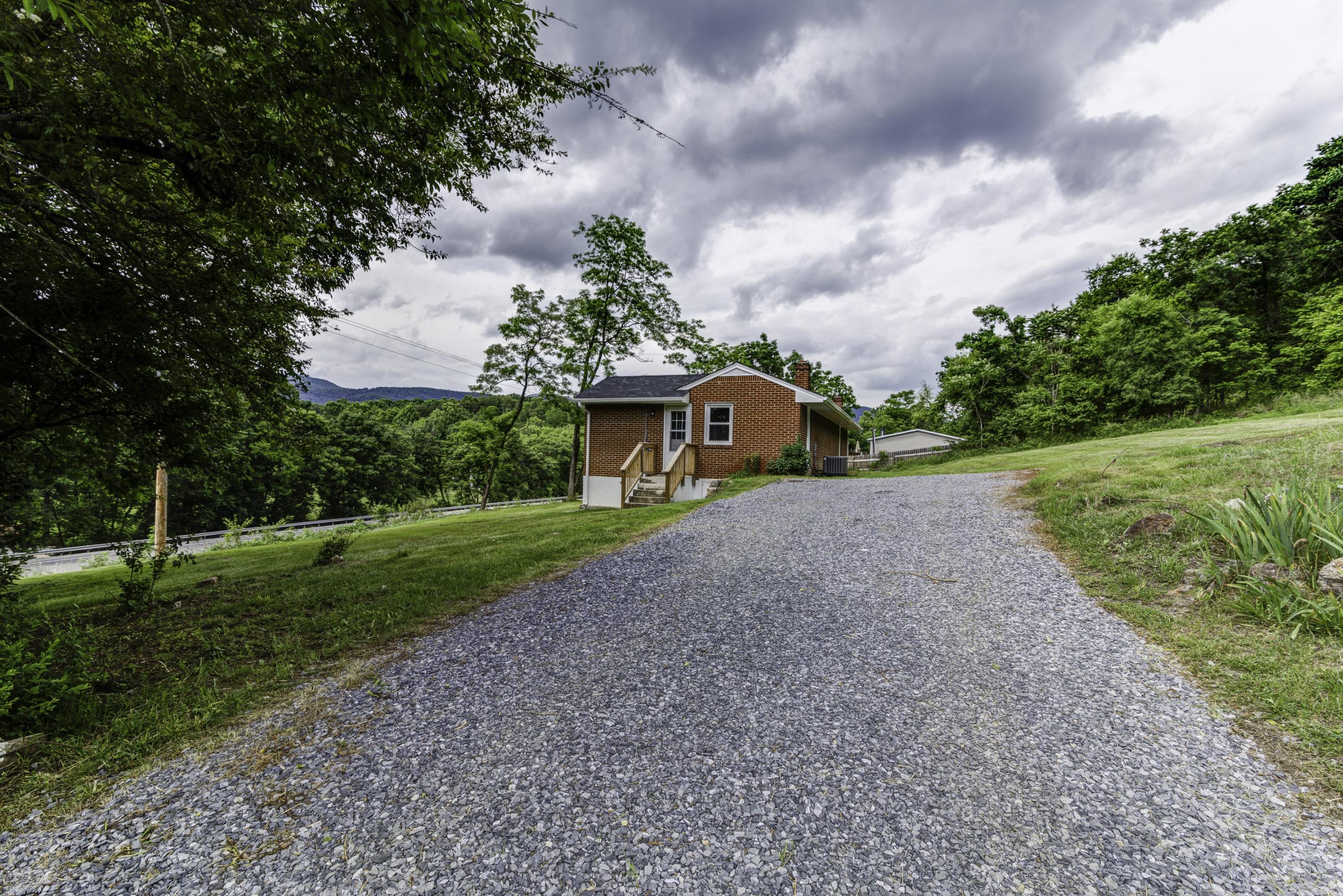 4600 Blue Ridge Boulevard Blue Ridge, VA 24064 - Photo 26 of 27 a front view of a house with garden