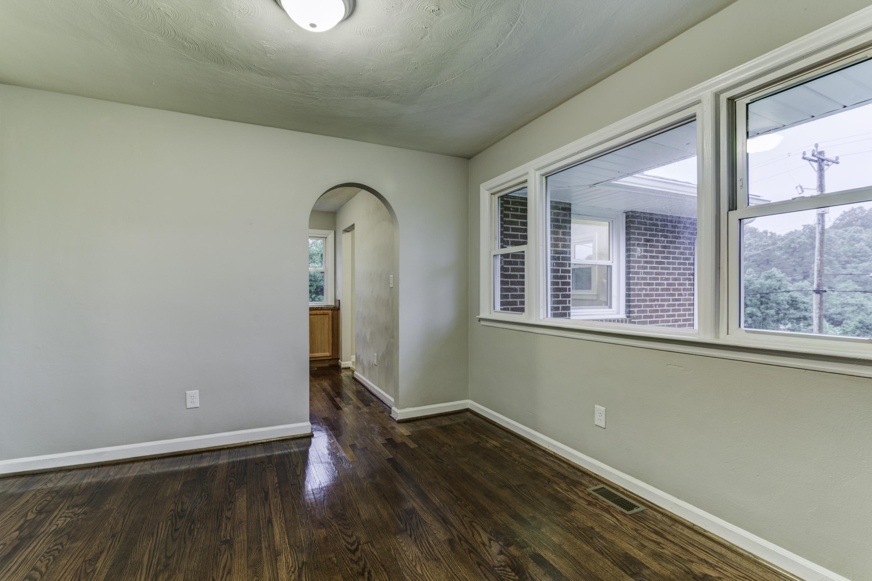 4600 Blue Ridge Boulevard Blue Ridge, VA 24064 - Photo 4 of 27 a view of empty room with wooden floor and fan