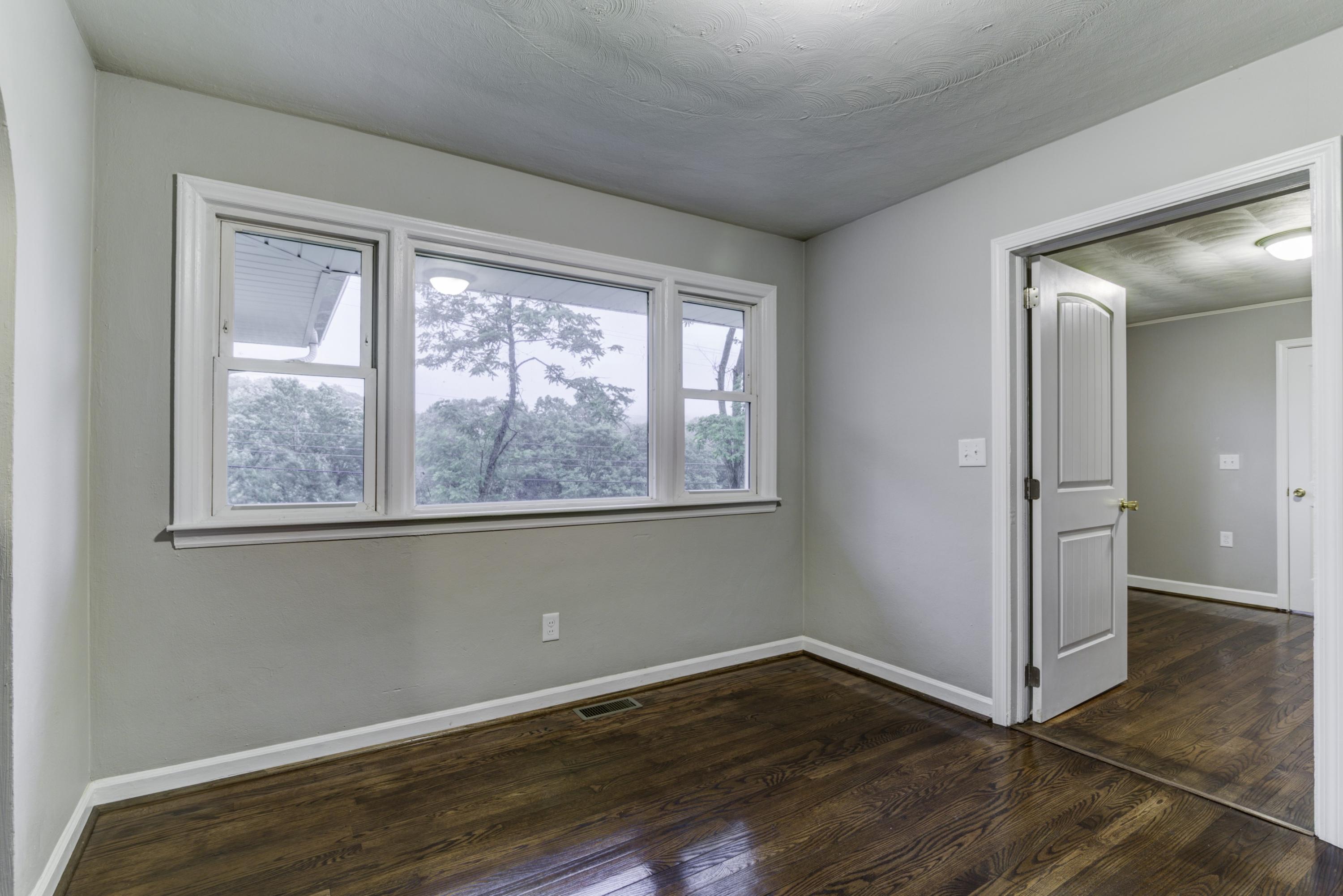 4600 Blue Ridge Boulevard Blue Ridge, VA 24064 - Photo 5 of 27 a view of an empty room with wooden floor and a window