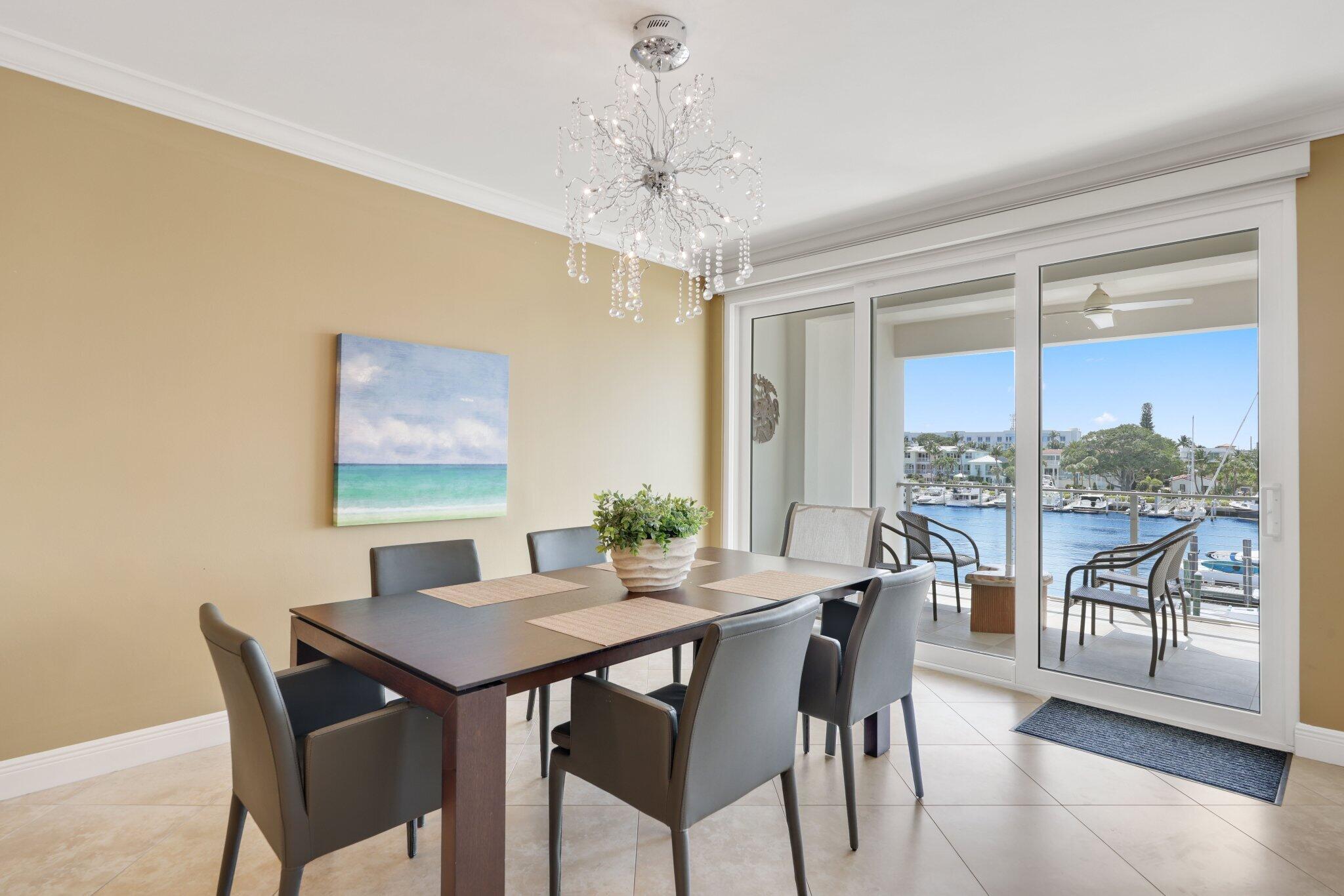 100 Mac Farlane Drive, Unit 3D Delray Beach, FL 33483 - Photo 12 of 57 a view of a dining room with furniture window and outside view