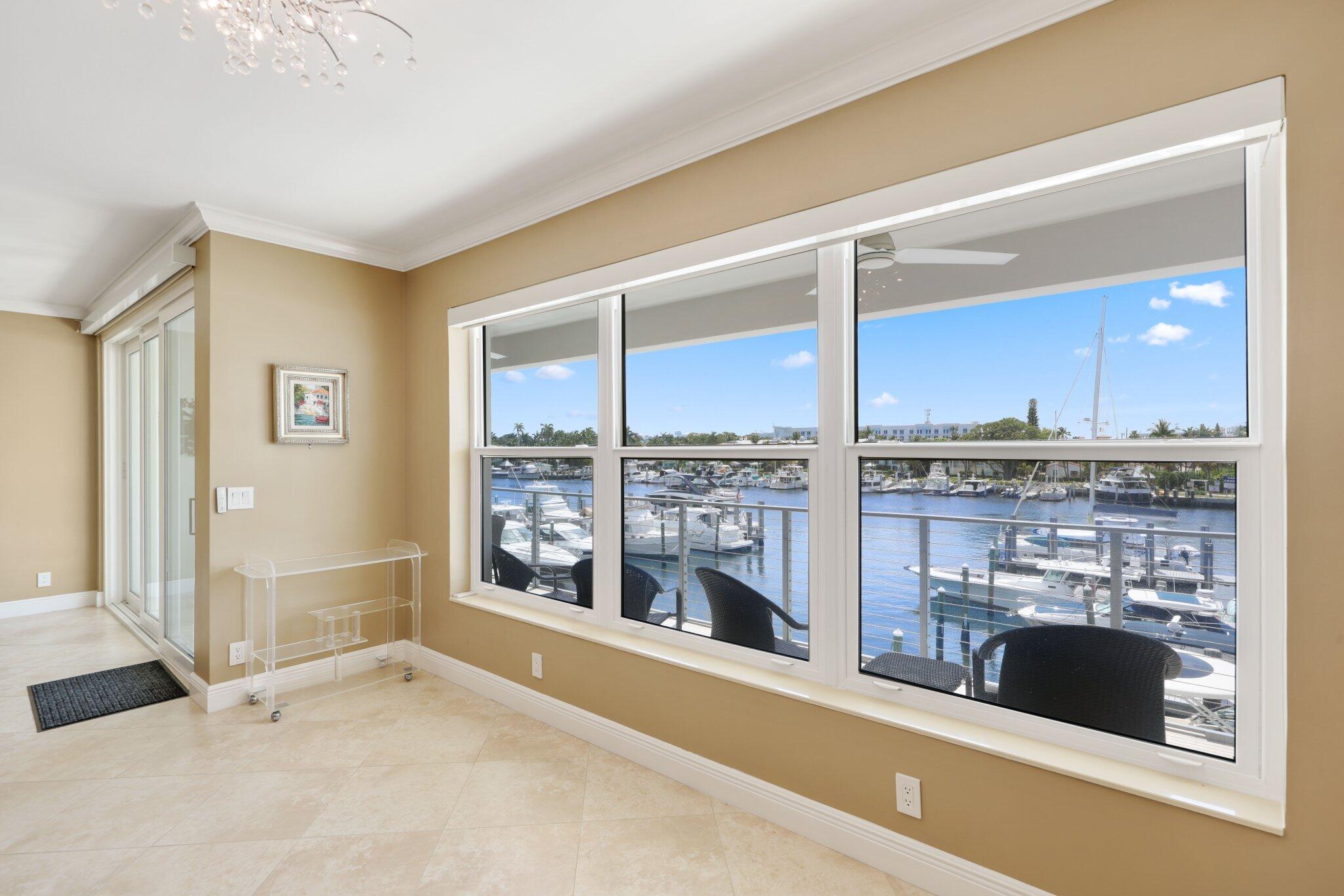 100 Mac Farlane Drive, Unit 3D Delray Beach, FL 33483 - Photo 16 of 57 a living room with a large window