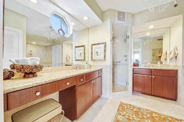 a spacious bathroom with a tub sink and mirror
