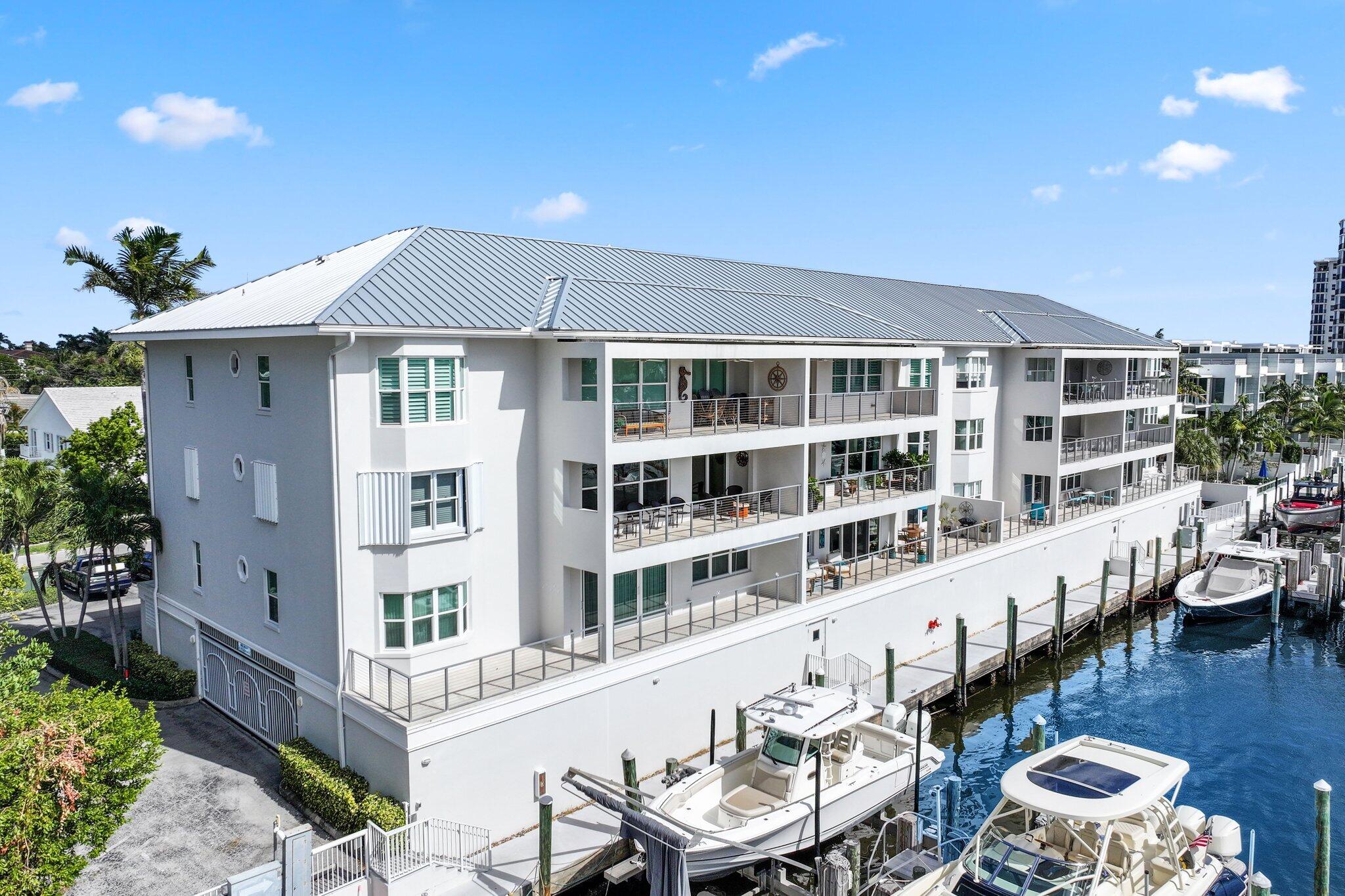 100 Mac Farlane Drive, Unit 3D Delray Beach, FL 33483 - Photo 4 of 57 a balcony with table and chairs
