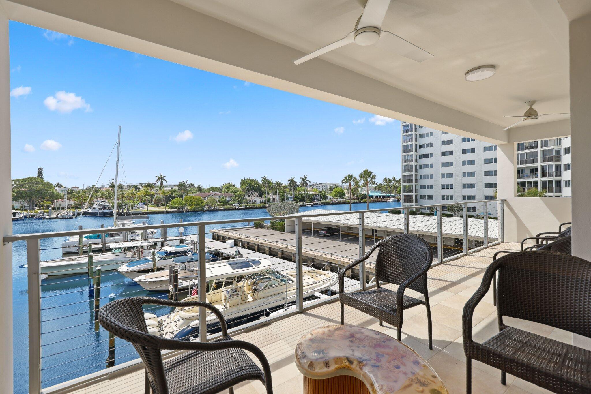 100 Mac Farlane Drive, Unit 3D Delray Beach, FL 33483 - Photo 42 of 57 a view of a chairs and table in patio