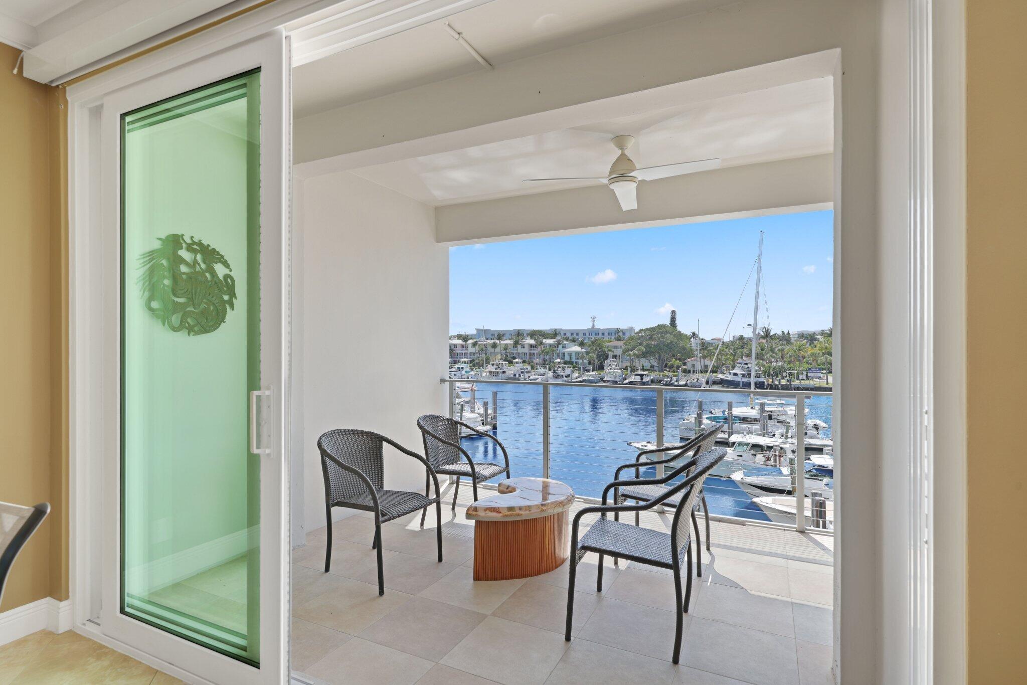100 Mac Farlane Drive, Unit 3D Delray Beach, FL 33483 - Photo 44 of 57 a view of a chairs and table in a balcony