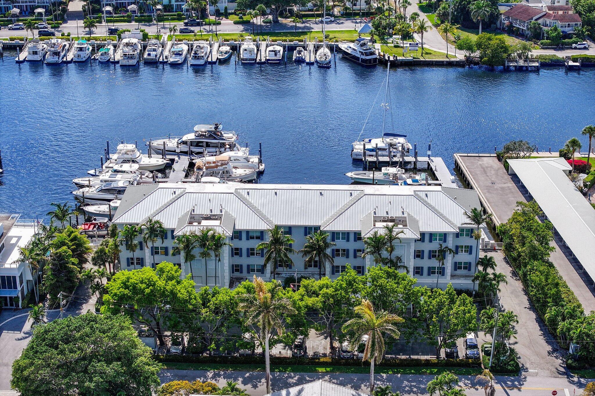 100 Mac Farlane Drive, Unit 3D Delray Beach, FL 33483 - Photo 46 of 57 a aerial view of a house with a lake view and boat
