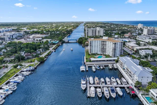 an aerial view of a house with a lake view