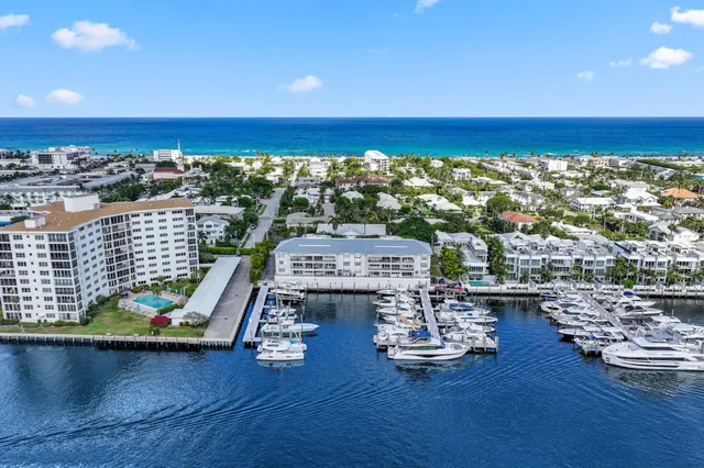 an aerial view of a house with a lake view