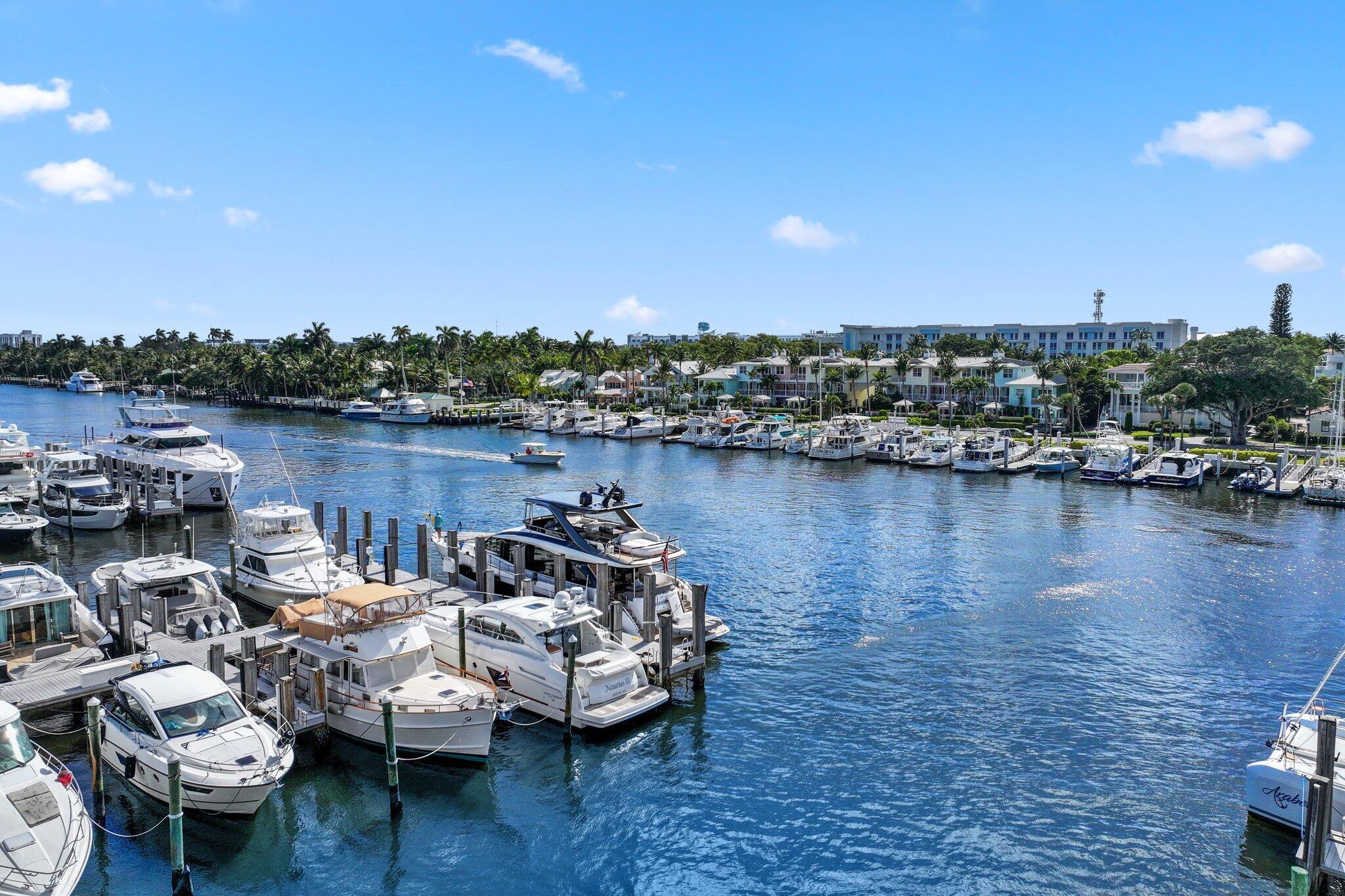100 Mac Farlane Drive, Unit 3D Delray Beach, FL 33483 - Photo 52 of 57 a view of a lake with boats and trees in the background
