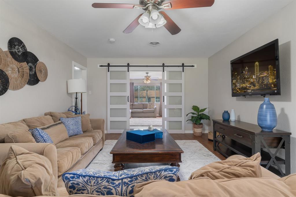 216 Belmont Drive Hurst, TX 76053 - Photo 1 of 1 a living room with furniture and a large window