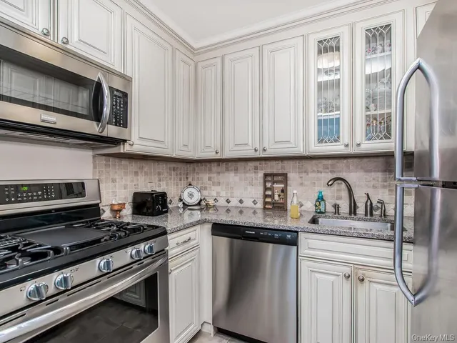 a bathroom with a toilet a sink and a mirror