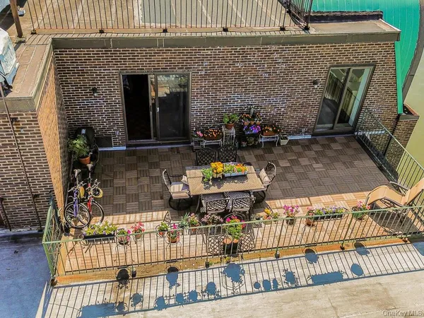 a front view of a house with outdoor seating