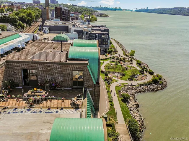 a view of swimming pool with outdoor seating and yard