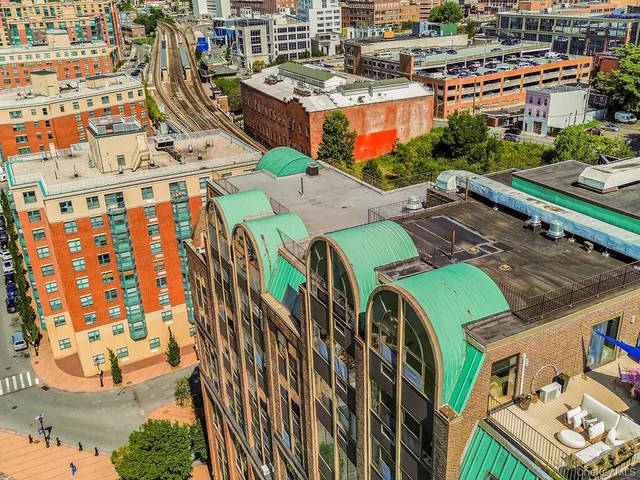 a balcony with table and chairs