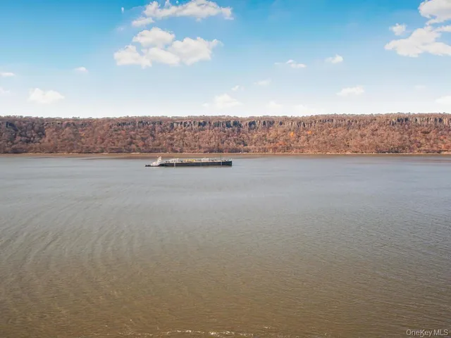 a kitchen with stainless steel appliances granite countertop a stove and a microwave