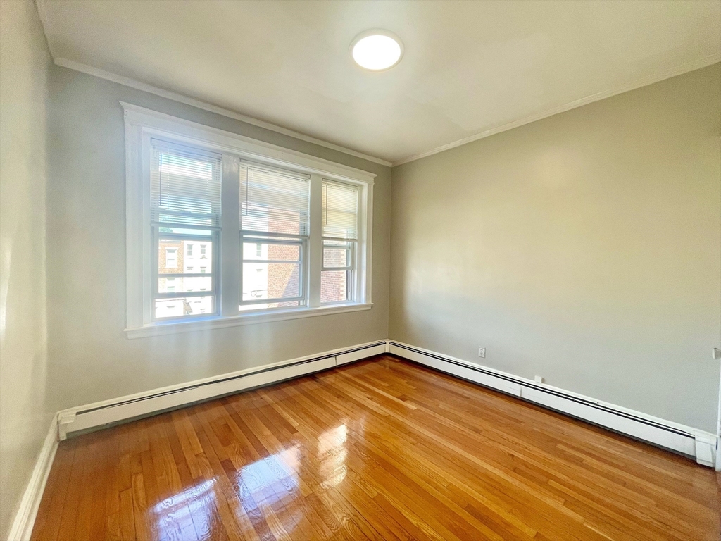 1653 Commonwealth Avenue, Unit 3 Boston, MA 02135 - Photo 12 of 12 wooden floor in a room with a window