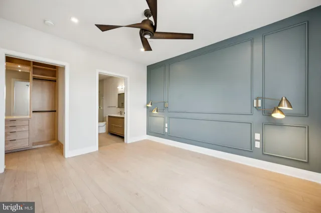 a view of a livingroom with a furniture and chandelier fan
