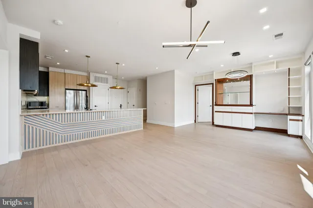 a view of a kitchen with furniture and cabinets
