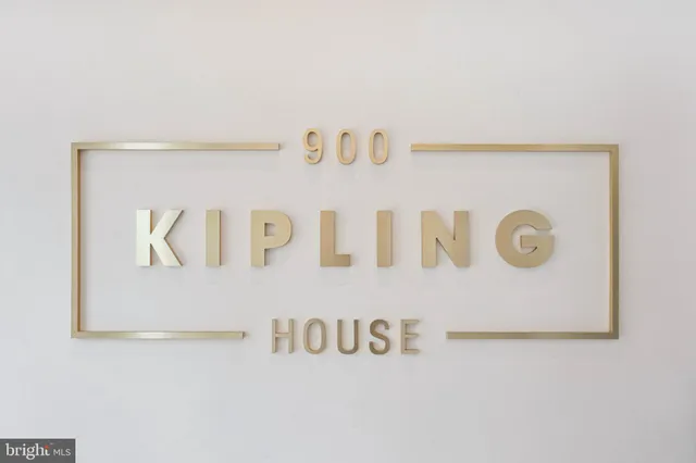 a living room with stainless steel appliances kitchen island granite countertop a refrigerator and a sink