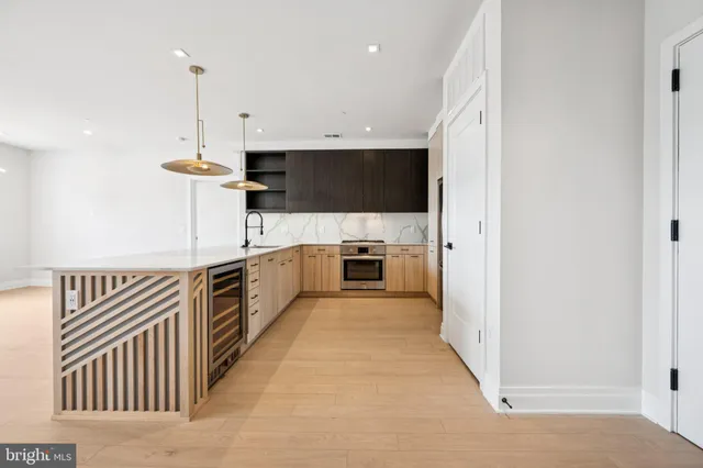 a view of a kitchen with electric appliances