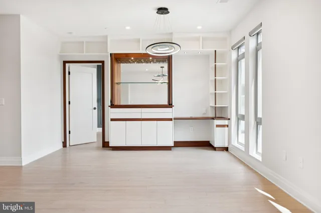 a view of kitchen with cabinets and wooden floor