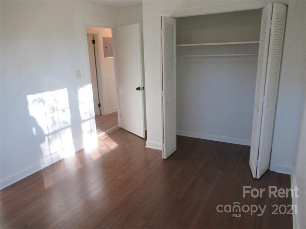1058 Springdale Drive Maiden, NC 28650 - Photo 13 of 21 a view of a hallway with wooden floor