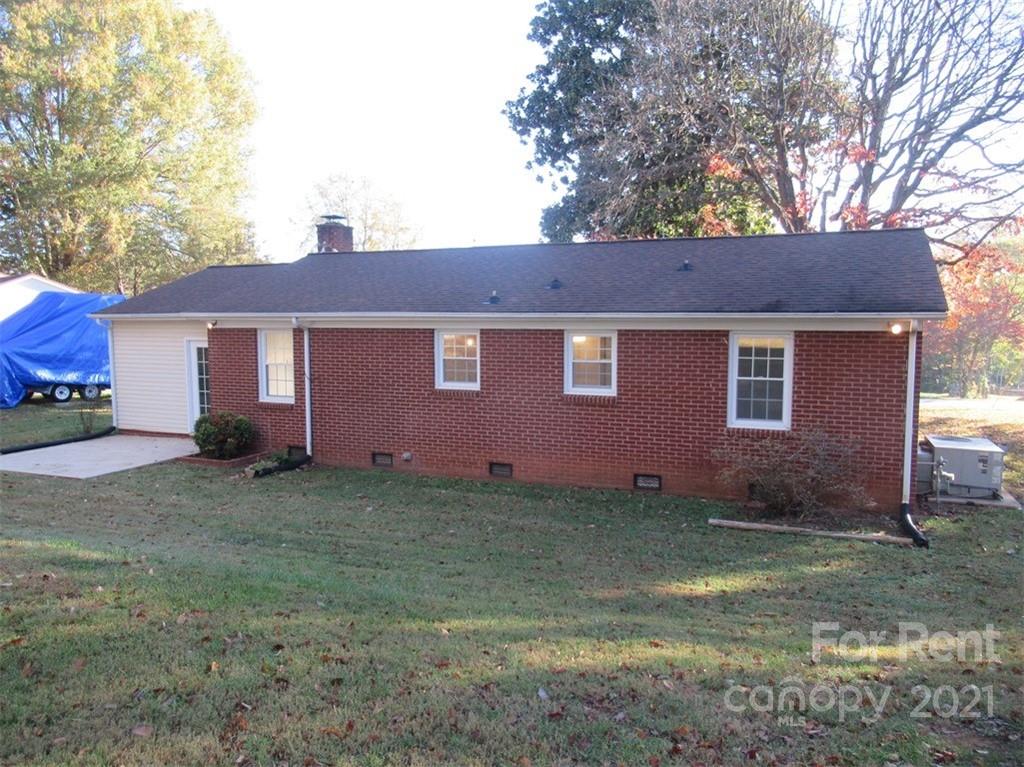 1058 Springdale Drive Maiden, NC 28650 - Photo 18 of 21 a view of a yard in front of a house with large tree