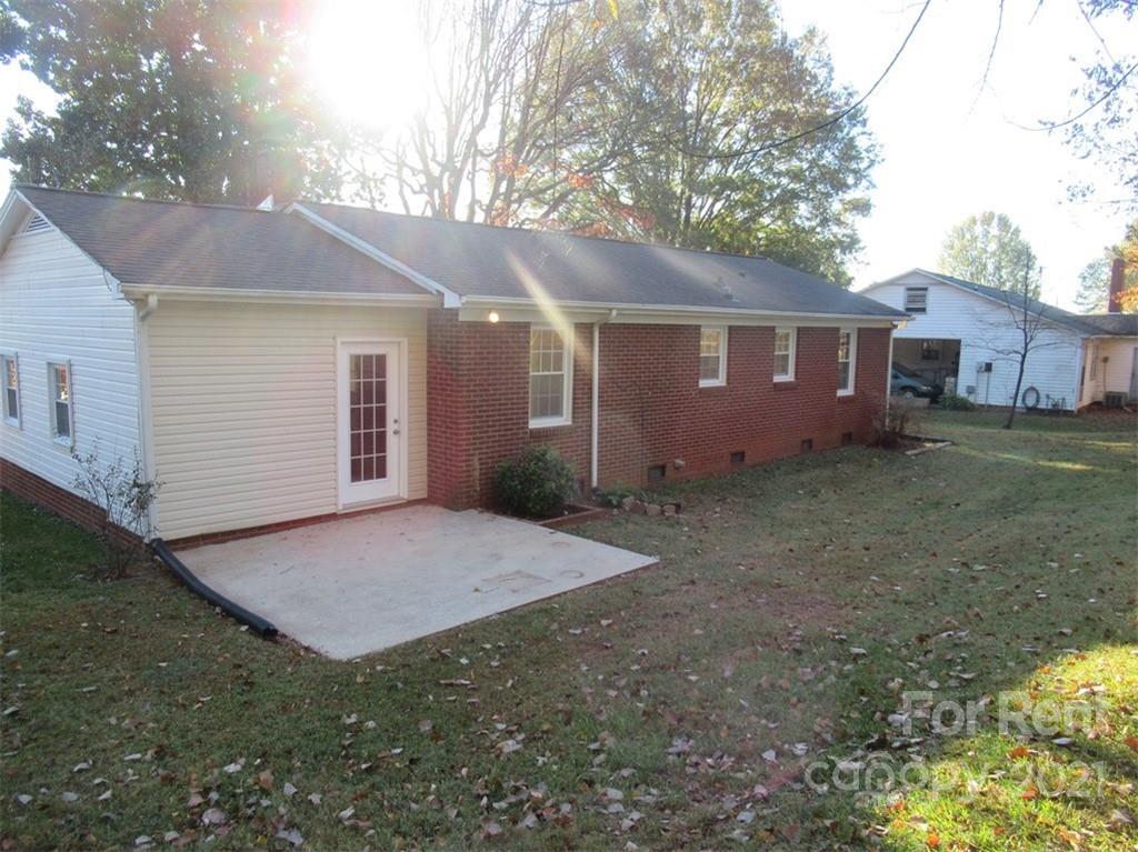 1058 Springdale Drive Maiden, NC 28650 - Photo 19 of 21 a view of a house with a yard and garage
