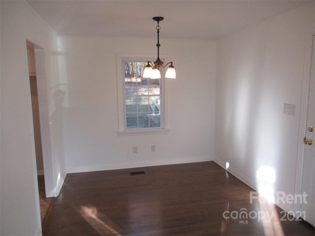 1058 Springdale Drive Maiden, NC 28650 - Photo 8 of 21 a view of a room with wooden floor and windows