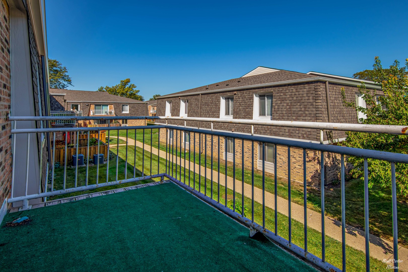 4608 Euclid Avenue, Unit 2B Rolling Meadows, IL 60008 - Photo 12 of 14 a view of a houses with a balcony