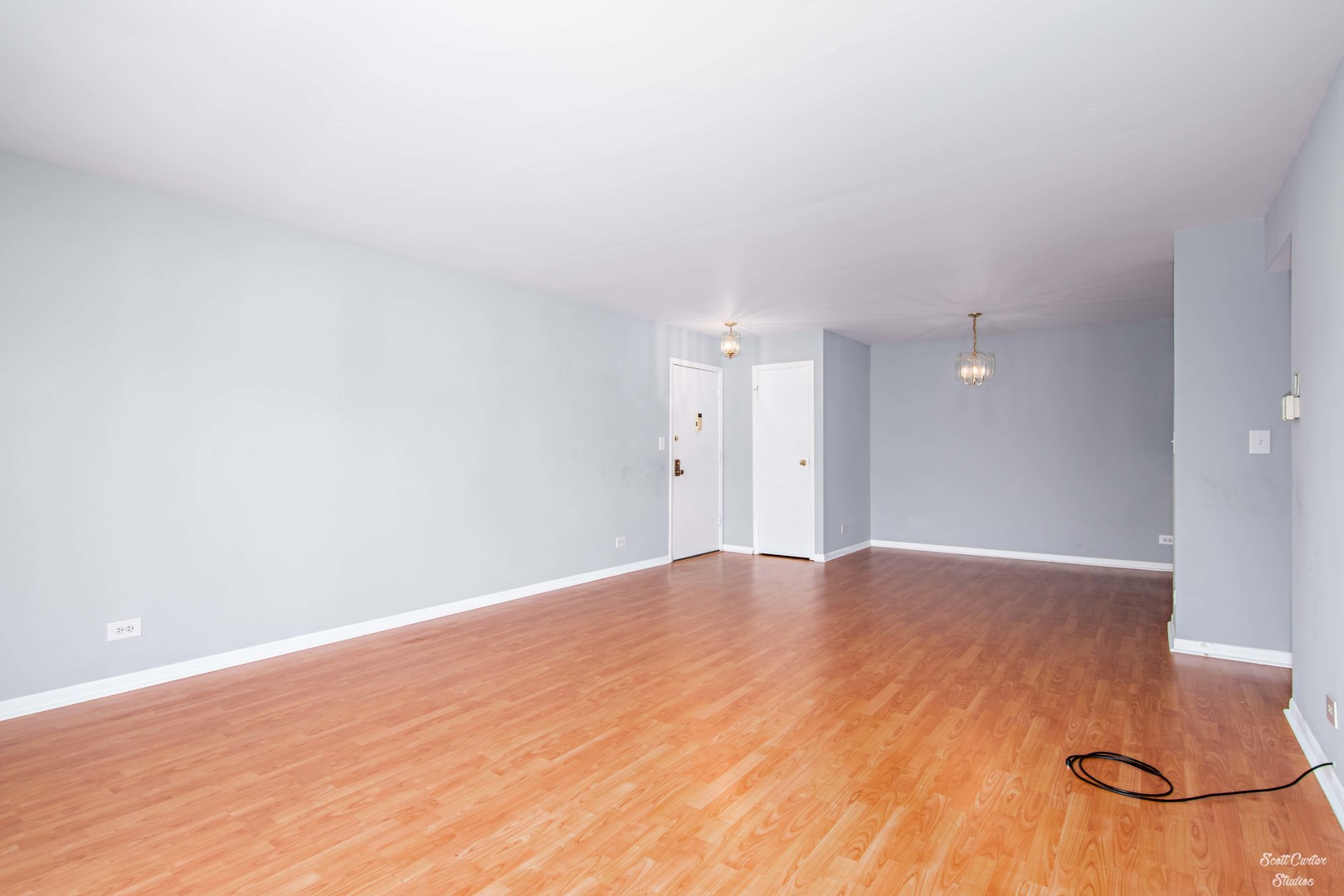 4608 Euclid Avenue, Unit 2B Rolling Meadows, IL 60008 - Photo 4 of 14 a view of empty room with wooden floor and fan