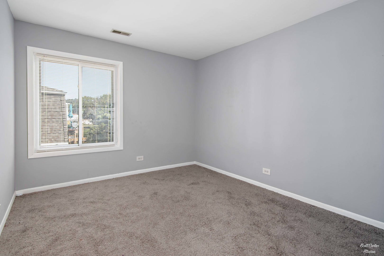 4608 Euclid Avenue, Unit 2B Rolling Meadows, IL 60008 - Photo 7 of 14 an empty room with a window