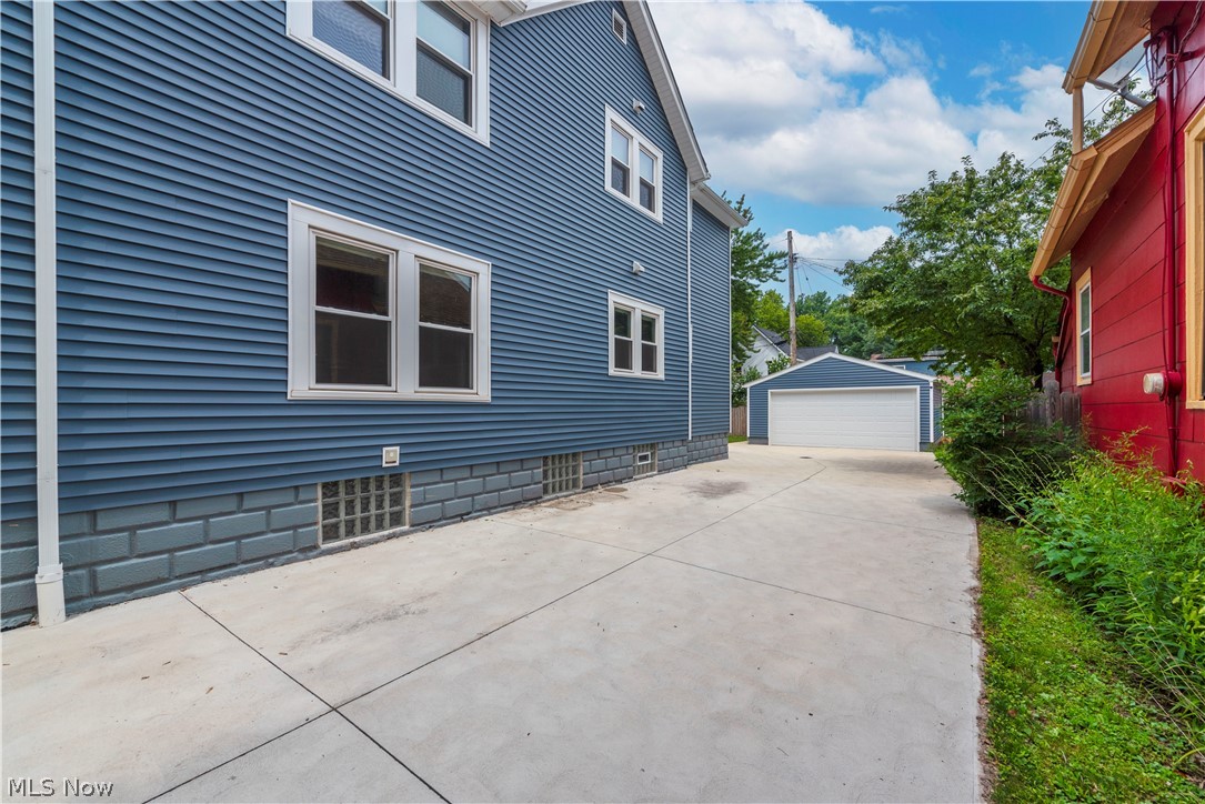 7408-7410 Rutledge Avenue Cleveland, OH 44102 - Photo 45 of 46 View of property exterior featuring a garage and an outdoor structure