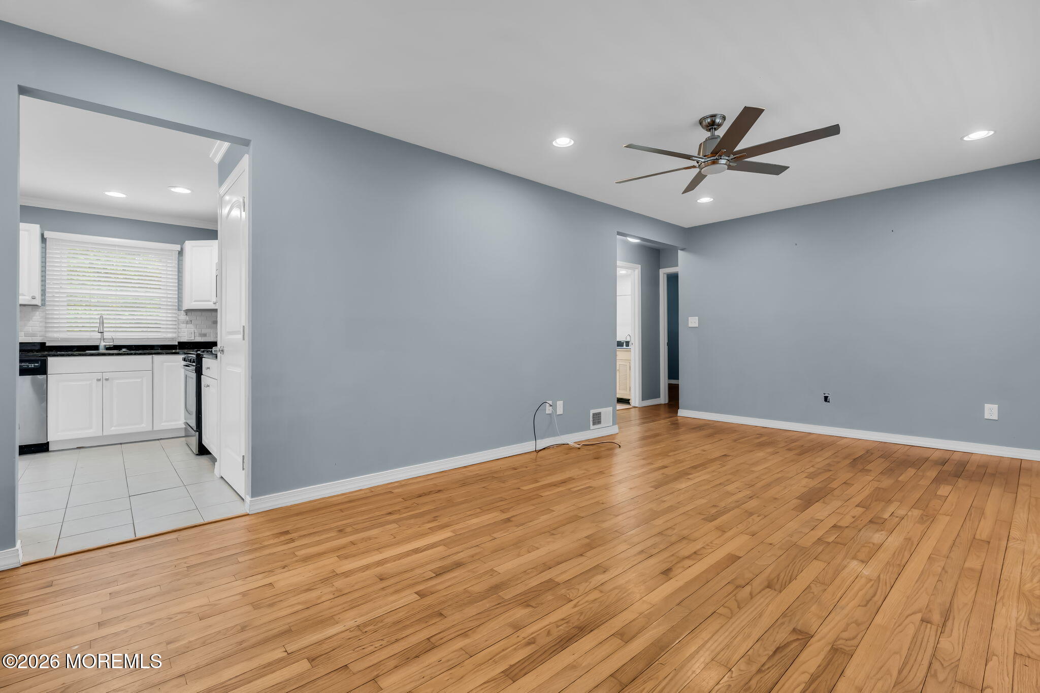 593 Beach Plum Road Brick, NJ 08723 - Photo 12 of 38 a view of empty room with wooden floor and window
