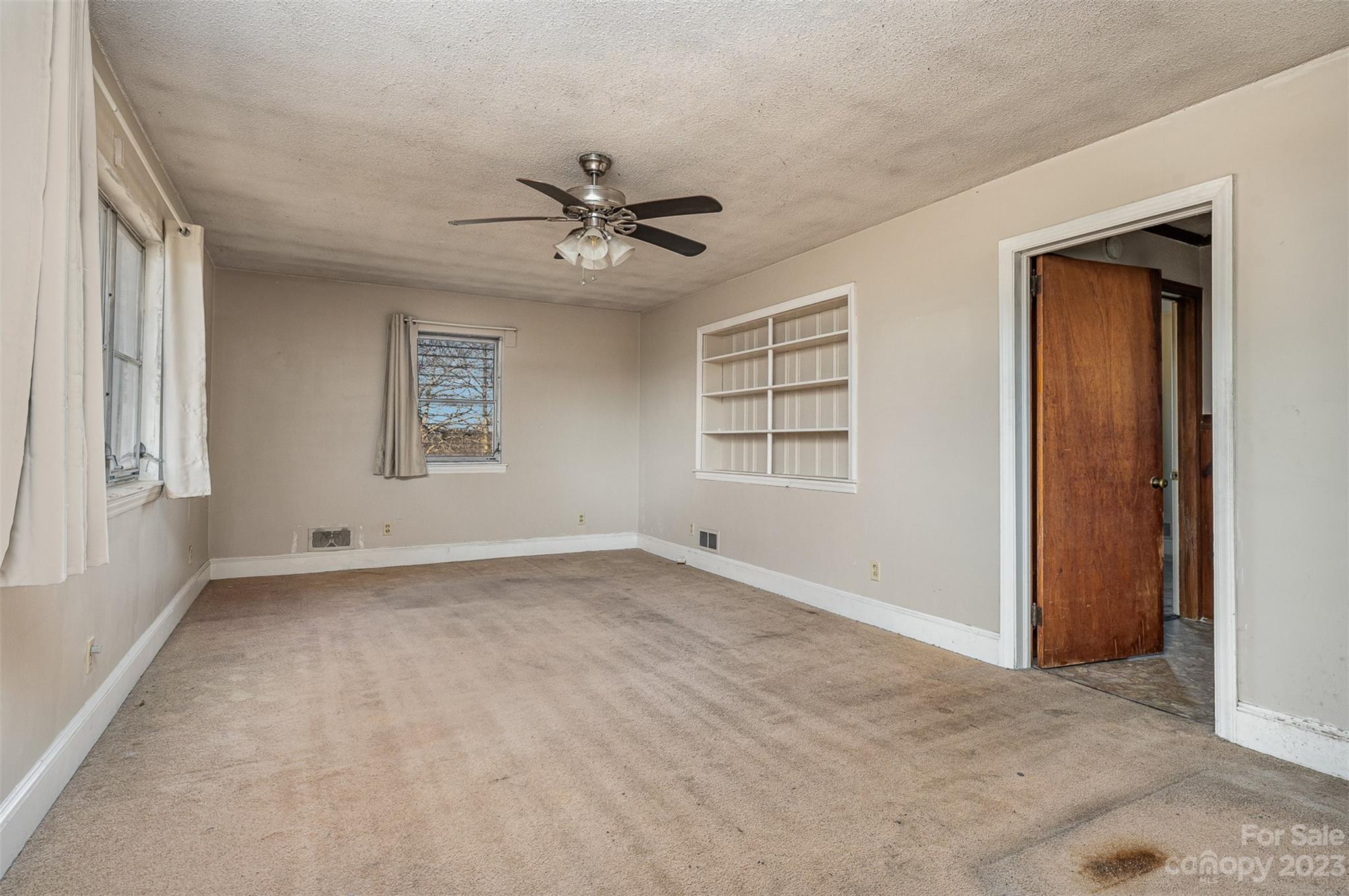 2765 Long Circle Iron Station, NC 28080 - Photo 12 of 26 an empty room with windows and closet