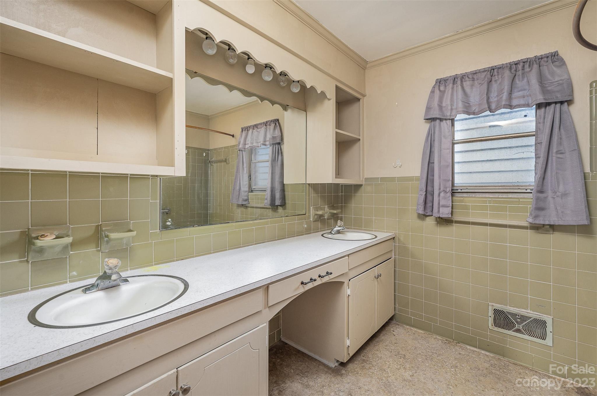 2765 Long Circle Iron Station, NC 28080 - Photo 16 of 26 a bathroom with a double vanity sink mirror and double