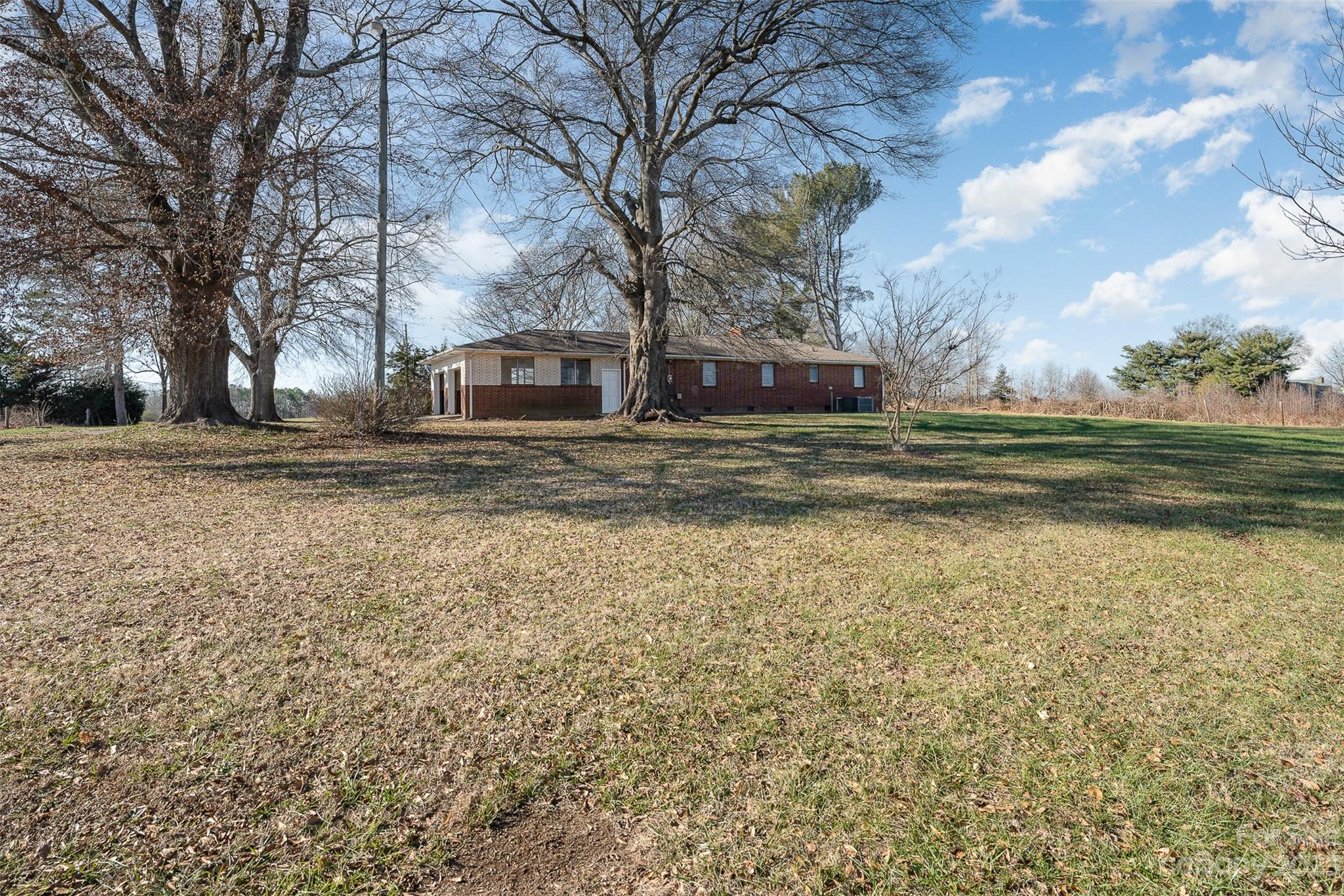 2765 Long Circle Iron Station, NC 28080 - Photo 4 of 26 a view of a house with a yard
